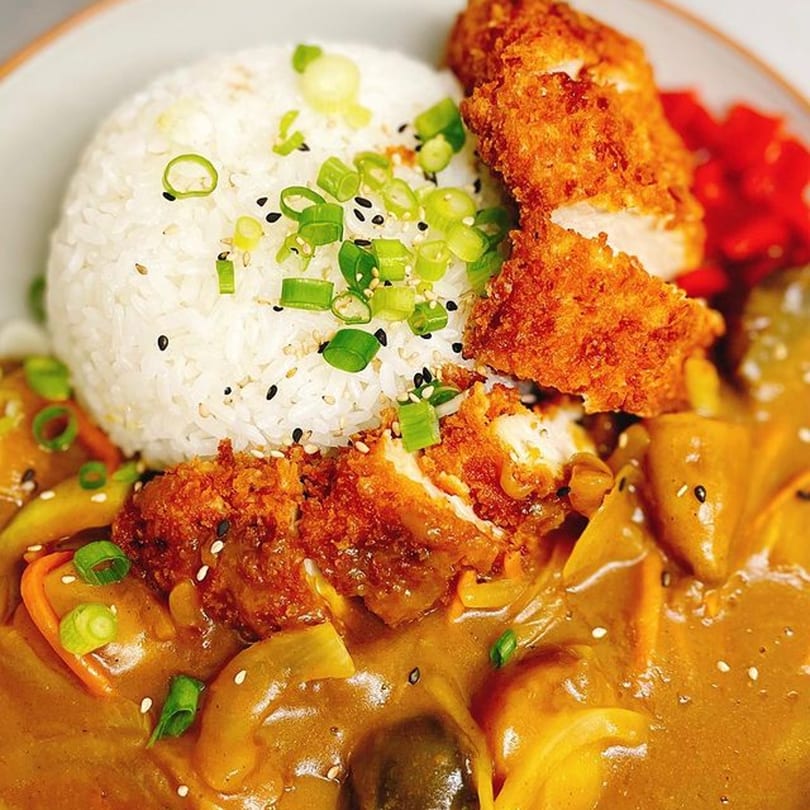 Soi Bistro's Japanese chicken katsu curry with rice, green onions, and red pickled ginger.